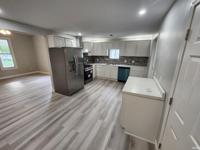 1584 Snyder St, Wabash, IN 46992 - kitchen with appliances with stainless steel finishes, plenty of natural light, backsplash, wall chimney range hood, and recessed lighting