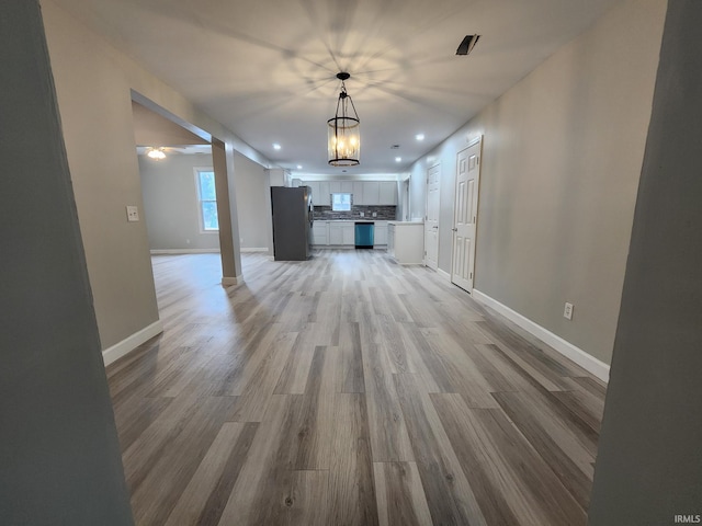1584 Snyder St, Wabash, IN 46992 - unfurnished living room featuring light wood-type flooring, recessed lighting, and a chandelier