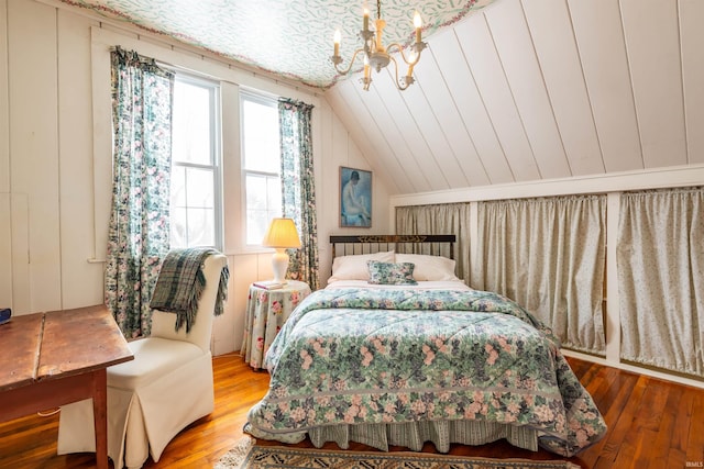 921 S Sheridan Dr, Bloomington, IN 47401 - bedroom featuring vaulted ceiling, a chandelier, and wood-type flooring