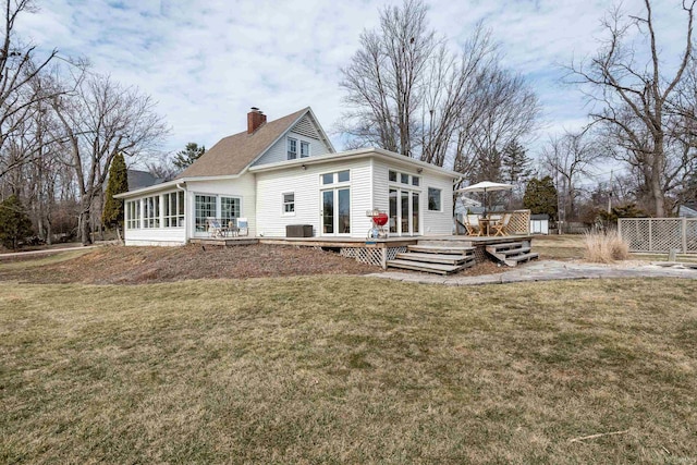 921 S Sheridan Dr, Bloomington, IN 47401 - back of house with a chimney, a wooden deck, and a sunroom