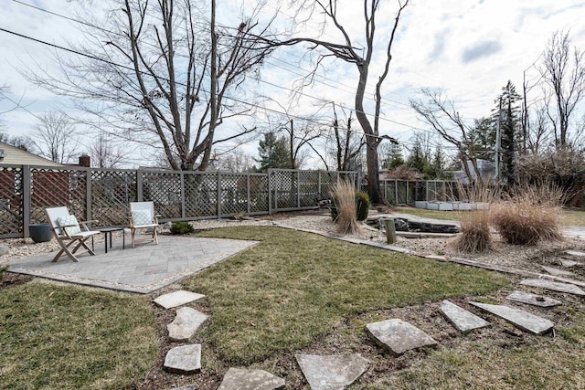 921 S Sheridan Dr, Bloomington, IN 47401 - fenced backyard featuring a patio area