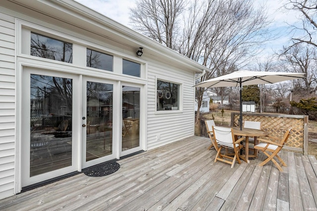 921 S Sheridan Dr, Bloomington, IN 47401 - wooden deck with outdoor dining area