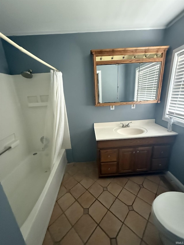 923 W Jackson St, Kokomo, IN 46901 - bathroom featuring vanity, shower / bath combo with shower curtain, and tile patterned flooring