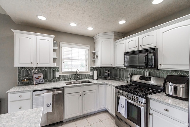 2123 Bunker Ln, Evansville, IN 47725 - kitchen featuring stainless steel appliances, open shelves, white cabinetry, recessed lighting, and decorative backsplash