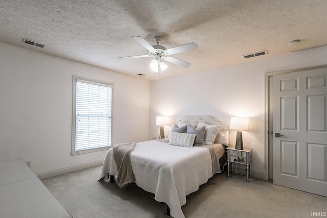 2123 Bunker Ln, Evansville, IN 47725 - bedroom with light carpet, a textured ceiling, and ceiling fan