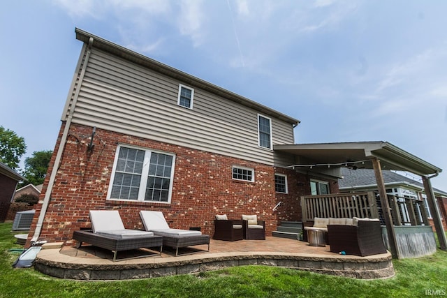 2123 Bunker Ln, Evansville, IN 47725 - back of property with a patio, brick siding, and outdoor lounge area