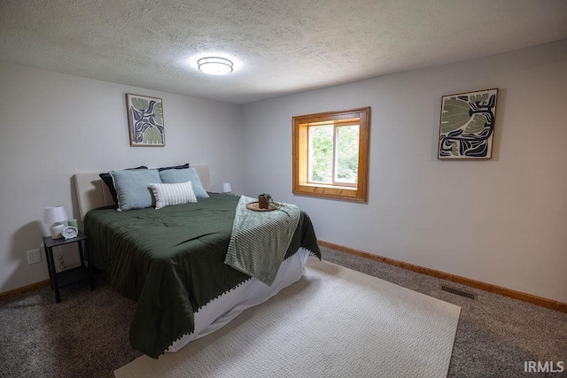 3529 S Walnut St, Muncie, IN 47304 - carpeted bedroom featuring a textured ceiling and baseboards