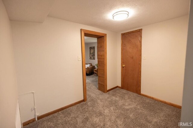 3529 S Walnut St, Muncie, IN 47304 - empty room featuring carpet floors and a textured ceiling