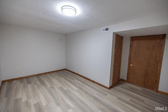 3529 S Walnut St, Muncie, IN 47304 - unfurnished room featuring light wood-style floors and a textured ceiling