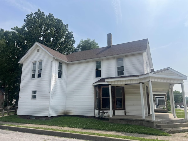 1200 Hartford St, Lafayette, IN 47904 - rear view of property with a chimney and a porch