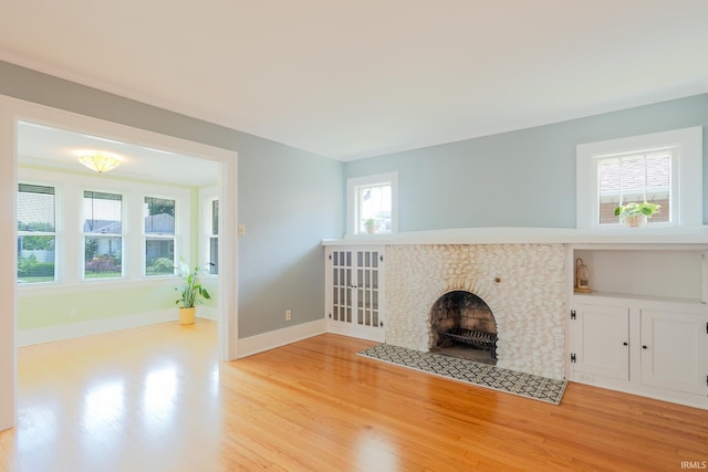 425 Gernhart Ave, Mishawaka, IN 46544 - unfurnished living room featuring wood finished floors and a tile fireplace