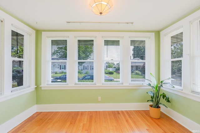 425 Gernhart Ave, Mishawaka, IN 46544 - unfurnished sunroom featuring wood finished floors, track lighting, and healthy amount of natural light