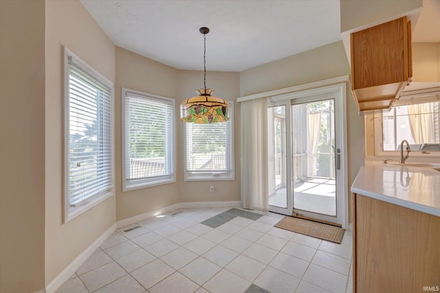 9109 S Front Nine Dr, Bloomington, IN 47401 - unfurnished dining area featuring a sink and light tile patterned flooring
