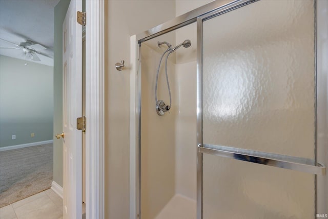 9109 S Front Nine Dr, Bloomington, IN 47401 - bathroom featuring ceiling fan, a shower stall, and tile patterned floors
