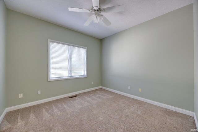 9109 S Front Nine Dr, Bloomington, IN 47401 - carpeted empty room featuring a ceiling fan and a textured ceiling