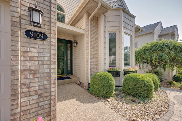 9109 S Front Nine Dr, Bloomington, IN 47401 - doorway to property featuring brick siding