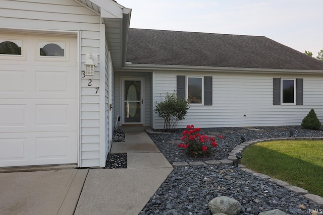 327 Hillside Ave, Roanoke, IN 46783 - entrance to property featuring roof with shingles and a garage