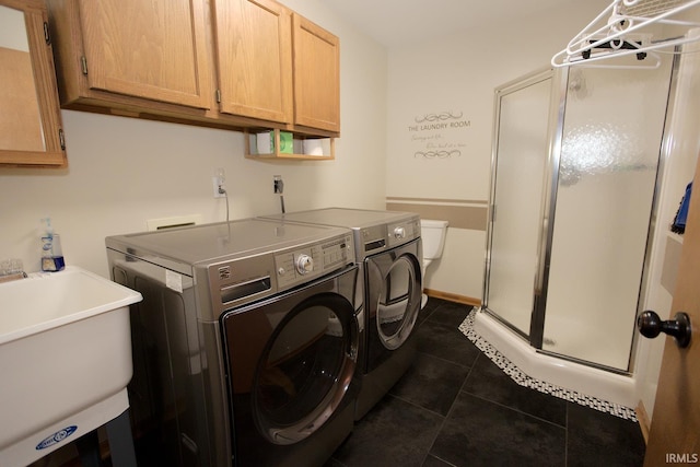 327 Hillside Ave, Roanoke, IN 46783 - laundry room featuring washing machine and clothes dryer, cabinet space, and dark tile patterned floors