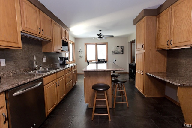 327 Hillside Ave, Roanoke, IN 46783 - kitchen featuring stainless steel dishwasher, a center island, tasteful backsplash, a kitchen bar, and ceiling fan