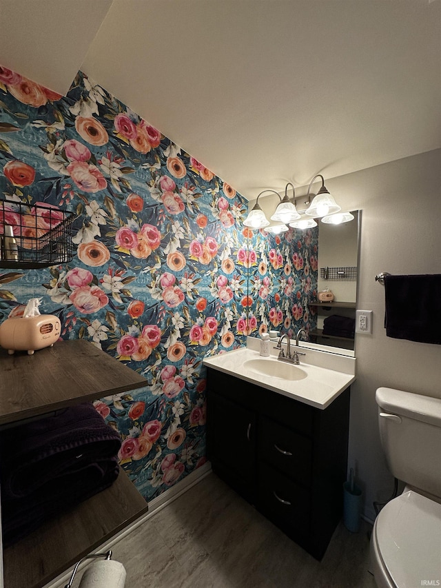 2023 E Columbia St, Evansville, IN 47711 - half bathroom featuring vanity and wallpapered walls