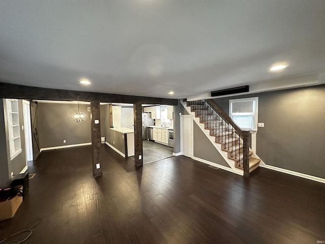 2023 E Columbia St, Evansville, IN 47711 - finished below grade area with stairs, dark wood finished floors, and recessed lighting