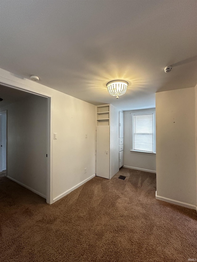 2023 E Columbia St, Evansville, IN 47711 - empty room with carpet and a smoke detector