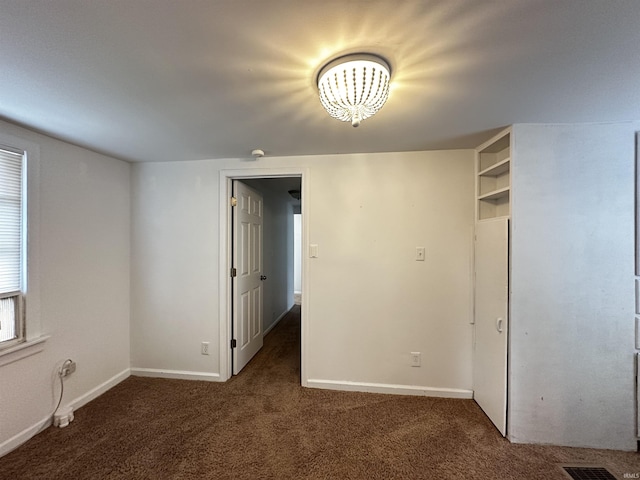 2023 E Columbia St, Evansville, IN 47711 - carpeted spare room featuring baseboards