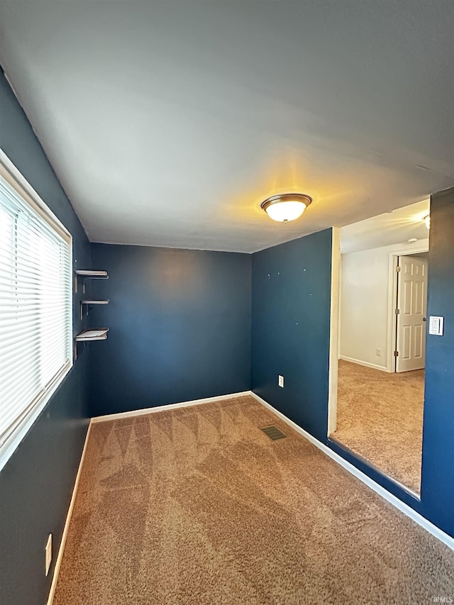 2023 E Columbia St, Evansville, IN 47711 - carpeted spare room featuring baseboards