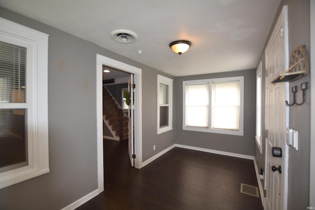 2023 E Columbia St, Evansville, IN 47711 - entryway with dark wood-style floors and stairs