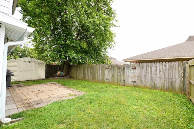 2023 E Columbia St, Evansville, IN 47711 - fenced backyard featuring a storage shed and a patio