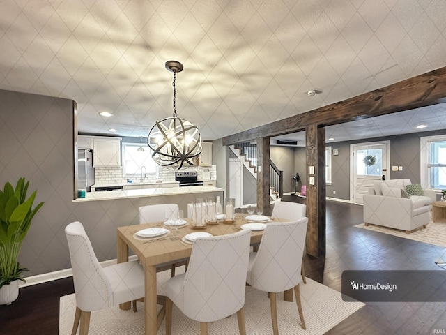 2023 E Columbia St, Evansville, IN 47711 - dining space with a chandelier and stairway
