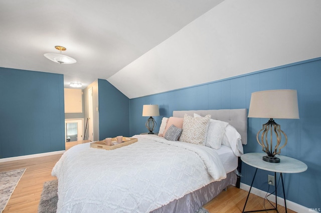 1730 Oak Park Dr, South Bend, IN 46617 - bedroom featuring wood finished floors and vaulted ceiling