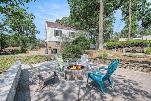 1730 Oak Park Dr, South Bend, IN 46617 - view of patio / terrace featuring an outdoor fire pit