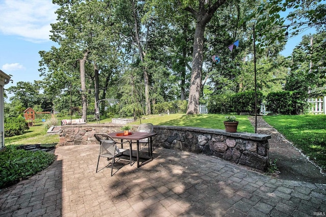 1730 Oak Park Dr, South Bend, IN 46617 - view of patio with outdoor dining area and a playground