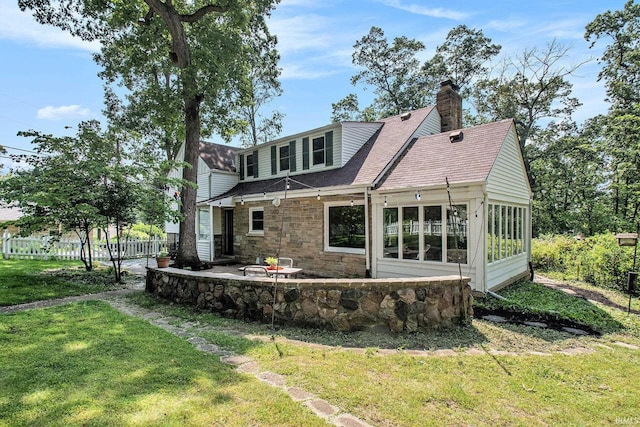 1730 Oak Park Dr, South Bend, IN 46617 - back of house with a patio area, a chimney, and roof with shingles