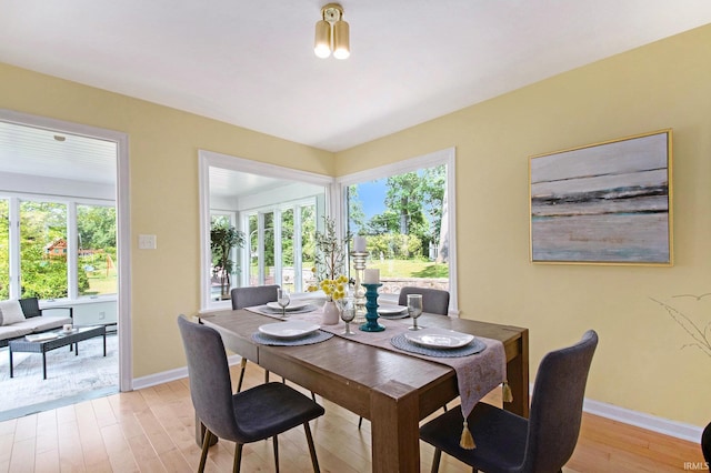 1730 Oak Park Dr, South Bend, IN 46617 - dining room featuring baseboards and light wood-style floors