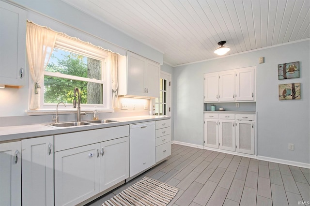 1730 Oak Park Dr, South Bend, IN 46617 - kitchen featuring white dishwasher, white cabinetry, light countertops, and crown molding