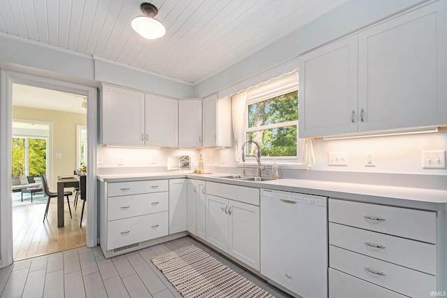 1730 Oak Park Dr, South Bend, IN 46617 - kitchen featuring white dishwasher, healthy amount of natural light, light countertops, and wooden ceiling