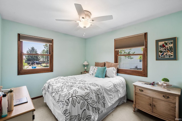 12199 Fields Farm Ct, Granger, IN 46530 - bedroom featuring light carpet, multiple windows, and ceiling fan