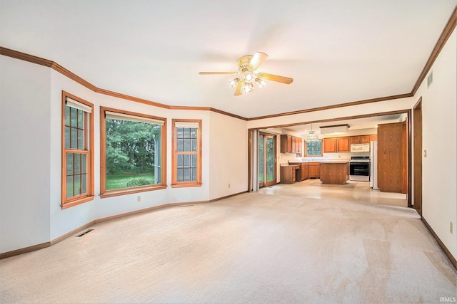 52206 Filbert Rd, Granger, IN 46530 - unfurnished living room featuring light carpet, ceiling fan, and crown molding