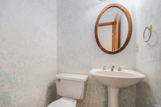 52206 Filbert Rd, Granger, IN 46530 - bathroom featuring wallpapered walls and toilet