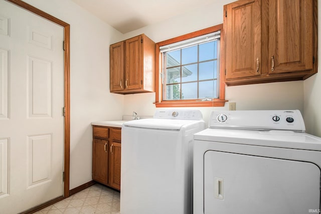 52206 Filbert Rd, Granger, IN 46530 - washroom with cabinet space, separate washer and dryer, and light floors