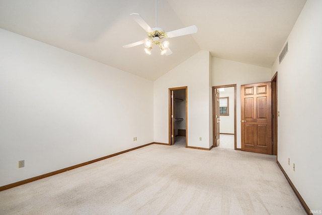 52206 Filbert Rd, Granger, IN 46530 - unfurnished bedroom featuring light colored carpet, high vaulted ceiling, a spacious closet, a closet, and a ceiling fan