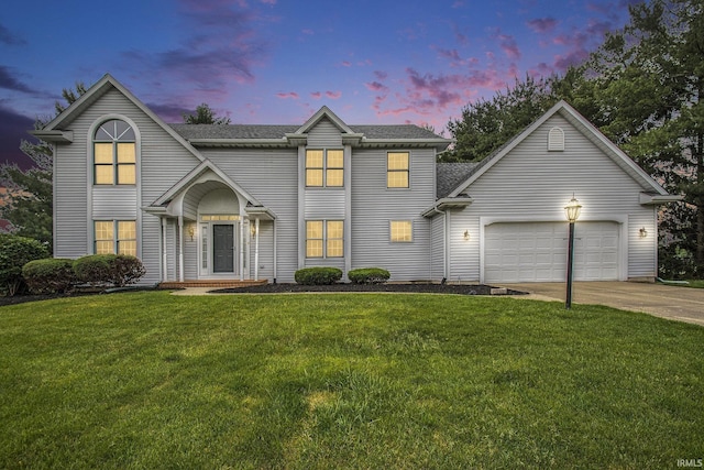 52206 Filbert Rd, Granger, IN 46530 - view of front facade with a garage, concrete driveway, a front lawn, and roof with shingles