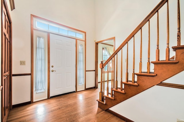 52206 Filbert Rd, Granger, IN 46530 - entrance foyer with wood finished floors, stairway, and a high ceiling