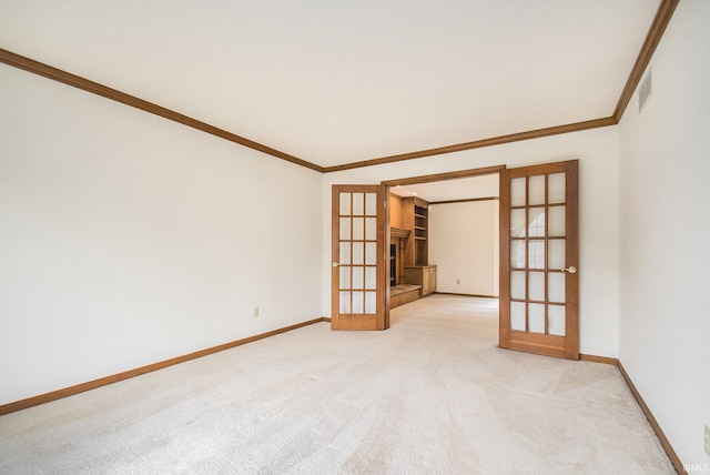 52206 Filbert Rd, Granger, IN 46530 - empty room with french doors, crown molding, and light colored carpet