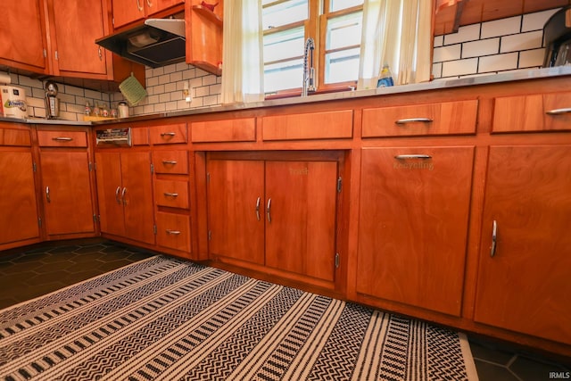 7420 S Fairfax Rd, Bloomington, IN 47401 - kitchen with under cabinet range hood, decorative backsplash, and stainless steel counters