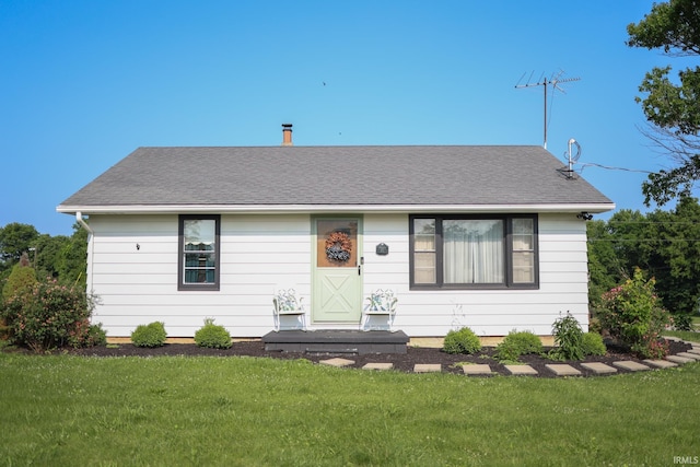 7420 S Fairfax Rd, Bloomington, IN 47401 - view of front facade with a front lawn and roof with shingles