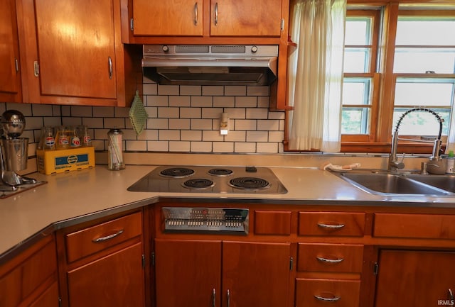 7420 S Fairfax Rd, Bloomington, IN 47401 - kitchen featuring range hood, electric stovetop, tasteful backsplash, and light countertops