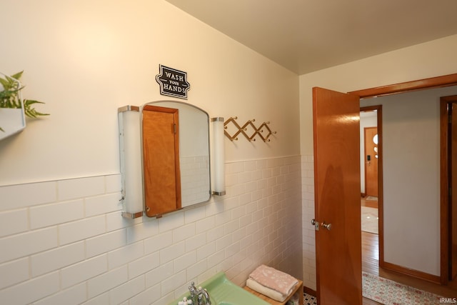 7420 S Fairfax Rd, Bloomington, IN 47401 - bathroom featuring tile walls, a wainscoted wall, and wood finished floors
